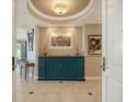 Inviting entryway featuring tile flooring and statement furniture piece at 990 Blvd Of The Arts # 1203, Sarasota, FL 34236