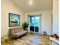 Cozy living area featuring a comfortable couch and sliding glass doors to the patio at 12286 23Rd E St, Parrish, FL 34219