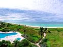 Breathtaking aerial view of a pool and beach at 2185 Gulf Of Mexico Dr # 245, Longboat Key, FL 34228