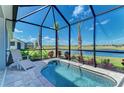 Screened-in pool with a view, patio furniture, and access to the outdoor living area at 264 Van Gogh Cv, Bradenton, FL 34212