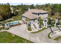 Stunning home with a private pool, meticulously maintained landscaping, and a circular driveway at 310 79Th Nw St, Bradenton, FL 34209