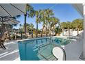 Backyard pool surrounded by lush landscaping offers a private, tropical oasis at 329 Avenida Leona, Sarasota, FL 34242