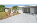 Charming single story home featuring a long driveway, freshly painted exterior and well manicured landscaping at 4335 Maceachen Blvd, Sarasota, FL 34233