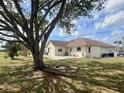 Spacious backyard with a patio area, perfect for outdoor entertaining at 503 Philodendron, Punta Gorda, FL 33955