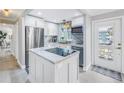 Stylish kitchen with a center island, modern appliances, and a bright, airy atmosphere at 5892 17Th W St # C25, Bradenton, FL 34207