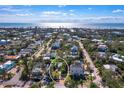 Residential neighborhood with palm trees and gulf views at 7119 Longboat E Dr, Longboat Key, FL 34228