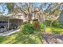 Home exterior with a convenient covered parking area and mature landscaping at 1615 Clower Creek Dr # 177, Sarasota, FL 34231