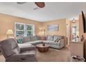 Living room with a large sectional sofa, perfect for relaxing or entertaining guests at 1622 17Th E St, Bradenton, FL 34208