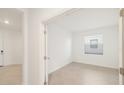 Bright bedroom features neutral paint, tile floors, baseboards, and a window at 3603 Night Star Terrace, Parrish, FL 34219