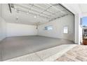 Large, clean garage space with bright lighting, finished floors, and a roll-up door, perfect for multiple vehicles at 45 Cape Haze Dr, Placida, FL 33946