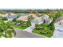 A sunny neighborhood street highlighting lush landscaping and meticulously maintained lawns at 6547 Oakland Hills Dr, Lakewood Ranch, FL 34202