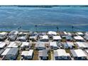 Beautiful aerial of the home in a waterfront community, enhanced by a surrounding view at 10315 Cortez W Rd # 17F, Bradenton, FL 34210