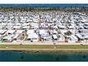 Fantastic areal view of the property nestled in a waterfront community overlooking a waterway at 10315 Cortez W Rd # 17F, Bradenton, FL 34210