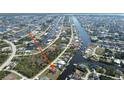 Expansive aerial view of a waterfront community with numerous canals at 15484 Alsask Cir, Port Charlotte, FL 33981