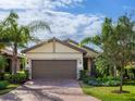 Charming single-story home with a brick driveway, well-kept lawn, and a two-car garage at 17019 Hampton Falls Ter, Lakewood Ranch, FL 34202