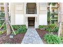 Inviting building entrance with manicured landscaping, showcasing the walkway leading to the entryway at 18008 Gawthrop Dr # 308, Bradenton, FL 34211