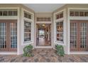 Grand entryway featuring tiled floor, high ceilings, and natural light at 22642 Morning Glory Cir, Bradenton, FL 34202