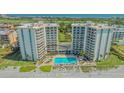Aerial shot of the community's pool and condo buildings at 2301 Gulf Of Mexico Dr # 33N, Longboat Key, FL 34228