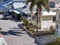 Street view of a cozy cottage featuring a cute entrance and well-manicured greenery at 7 High St, Bradenton, FL 34208