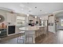 Modern kitchen features a large island, stainless steel appliances, and sleek pendant lighting at 11050 Sandhill Preserve Dr, Sarasota, FL 34238