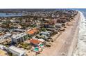Aerial shot showcasing the beachfront condo's proximity to the beach and surrounding neighborhood at 1300 Gulf Blvd # 202, Indian Rocks Beach, FL 33785