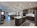 Spacious open kitchen featuring a large island and stainless steel appliances at 209 Okeeffe Cir, Bradenton, FL 34212