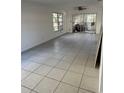 Spacious living room with neutral walls, tile flooring and access to the outside at 216 Amherst Ave # 97, Sarasota, FL 34232