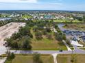 Expansive land parcel surrounded by lush greenery and mature trees in a serene neighborhood at 2900 Curry Ln, Nokomis, FL 34275