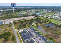 Wide aerial shot featuring a large land parcel in a community with ponds and easy highway access at 2900 Curry Ln, Nokomis, FL 34275