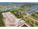 Expansive land parcel highlighted, showing neighborhood homes, ponds, and nearby construction at 2900 Curry Ln, Nokomis, FL 34275