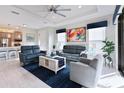 Bright living room featuring tile floors, modern furniture and a ceiling fan at 3008 Tolmino Ct, Lakewood Ranch, FL 34211