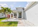 Inviting front porch with seating area and decorative features adding charm to the home's entrance at 3711 Manorwood Loop, Parrish, FL 34219