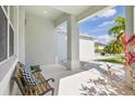 Inviting front porch with seating area offering a relaxing outdoor space at 3711 Manorwood Loop, Parrish, FL 34219