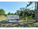Glenbrooke Deed Restricted community sign with a serene water view under a bright, sunny sky at 4712 Glenbrooke Dr, Sarasota, FL 34243