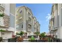 Beautiful townhome featuring stone accents, private balconies, and well-maintained landscaping at 512 Laurel Park Dr, Sarasota, FL 34236