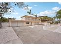 Charming two-story home with an attached garage and spacious driveway at 55 N Washington Dr, Sarasota, FL 34236