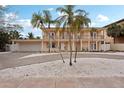 Beautiful two-story home featuring a charming balcony and well-kept grounds at 55 N Washington Dr, Sarasota, FL 34236