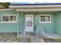 Inviting front porch with seating, a white door, and easy access at 1111 26Th Street E Ct, Palmetto, FL 34221