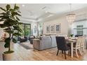 Spacious living room with tile floors, stylish furnishings, and abundant natural light at 1604 Still River Dr, Venice, FL 34293