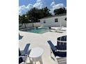 Inviting pool area with modern patio furniture and ample space for relaxation and entertainment at 2180 Orchid St, Sarasota, FL 34239