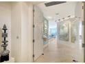 Inviting foyer featuring elegant tile flooring and modern art installations at 35 Watergate Dr # 1101, Sarasota, FL 34236