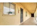 Exterior hallway featuring unit 320 with decorative window box and welcoming covered corridor at 3658 Lake Bayshore Dr # 320, Bradenton, FL 34205