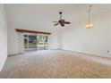 Spacious living room featuring a large sliding glass door to the outside, allowing for plenty of natural light at 3902 36Th Avenue W Dr, Bradenton, FL 34205
