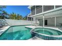 Inviting backyard pool and spa area, perfect for relaxation and entertaining at 462 Island Cir, Sarasota, FL 34242