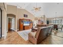 Inviting living area with a large TV, comfortable seating, and views into the adjacent dining room at 6211 90Th Avenue E Cir, Parrish, FL 34219