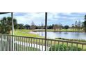 Scenic view of the community pond and golf course from the screened-in lanai at 6834 Fairview Ter # 6834, Bradenton, FL 34203