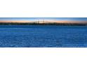 Expansive water view showcasing the iconic bridge stretching across Tampa Bay at sunset providing an amazing backdrop at 7706 Desoto Memorial Hwy, Bradenton, FL 34209