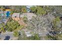 A cozy home with an attractive driveway, pool, and fenced yard at 813 Plymouth St, Sarasota, FL 34242