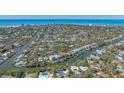 Expansive aerial shot showcasing a waterfront community with stunning views of the Gulf of Mexico at 813 Plymouth St, Sarasota, FL 34242