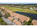 The view from above showcases the condo community, overlooking the golf course and pond views at 923 Fairwaycove Ln # 103, Bradenton, FL 34212